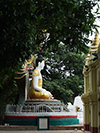 Buddha with varada while seated on naga